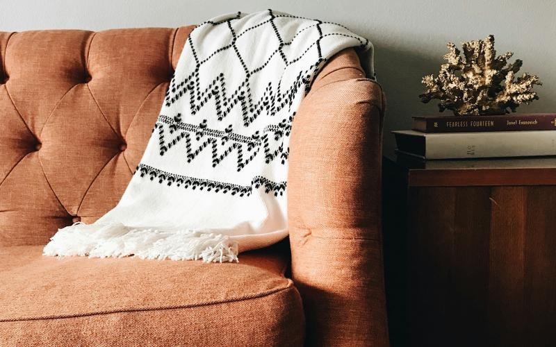 a couch with a pillow on it