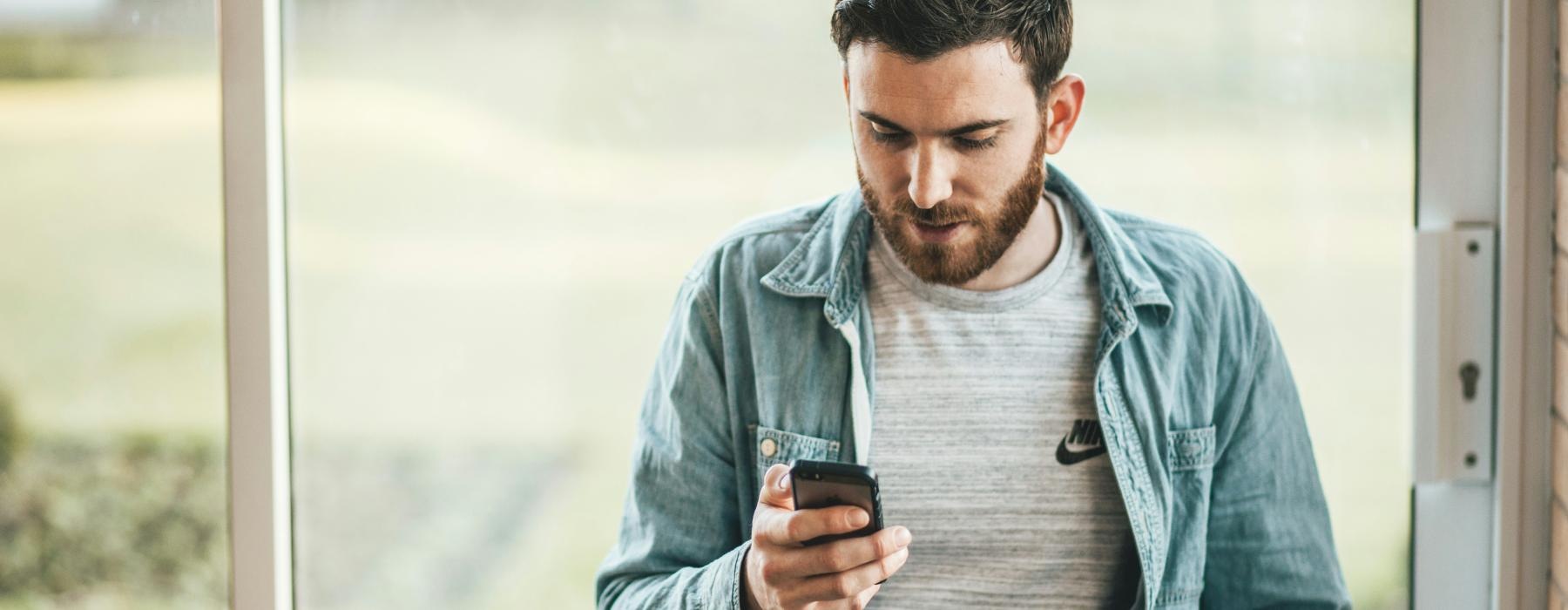 a man looking at his phone